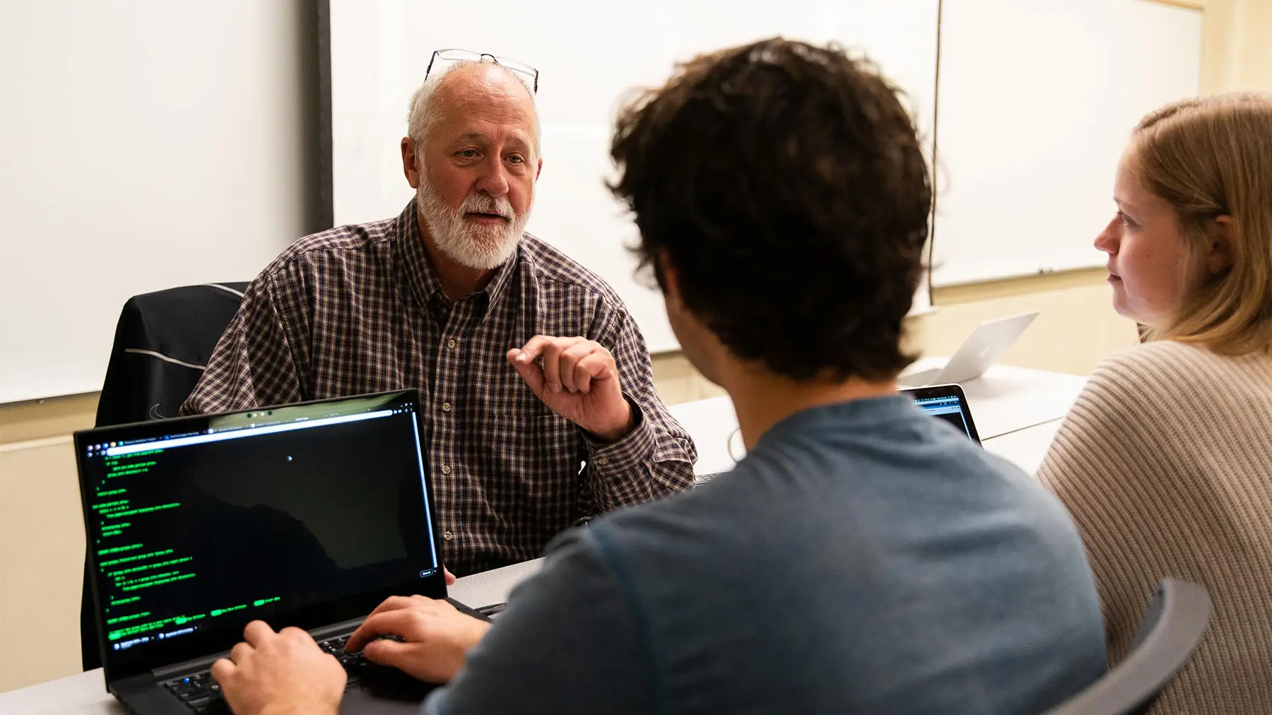 Professor interacts with students